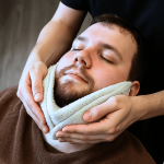 Client receiving a beard treatment